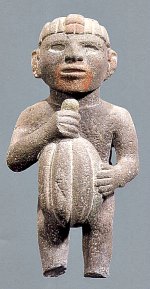 Ancient statue of a man holding a cacao pod.
