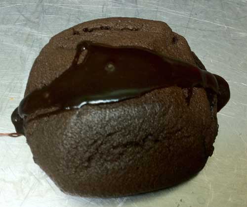 Photo of baked and topped  molten fudge cake cookie.