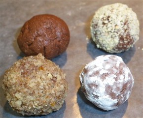Chocolate balls covered in pecans, powdered sugar or graham cracker crumbs.