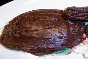 Fudge-like chocolate cookie on a plate.