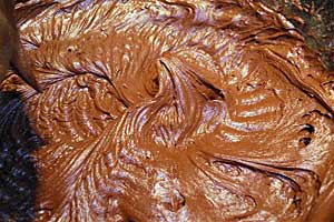 Bowl of chocolate dark frosting.