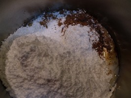 Chocolate fudge frosting ingredients in the saucepan.