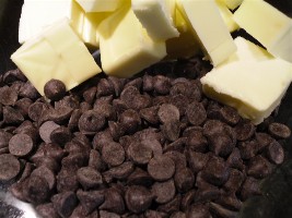 Chocolate chips and chunks of butter ready to be melted.