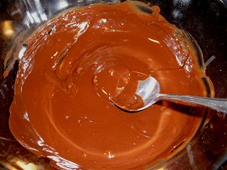 Melting the chocolate is the first step of the chocolate pecan pie recipe.