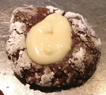 Versatile chocolate thumbprint cookie with vanilla filling.