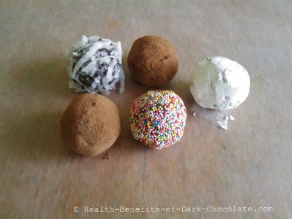 Homemade dark chocolate truffles with various coatings.