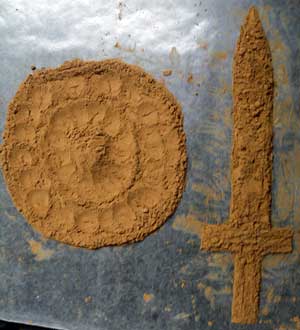 Sword and shield made from natural cocoa powder.
