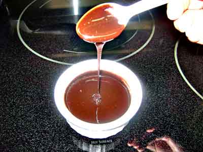 Homemade chocolate syrup in a ramekin.