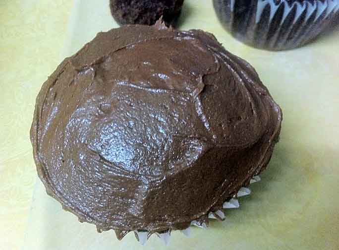Chocolate cupcake with dark chocolate frosting.