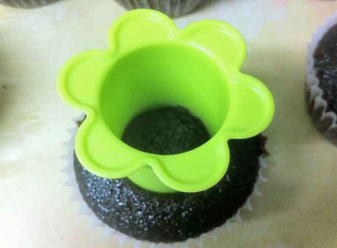 Death by chocolate cupcake with cupcake corer embedded in it.