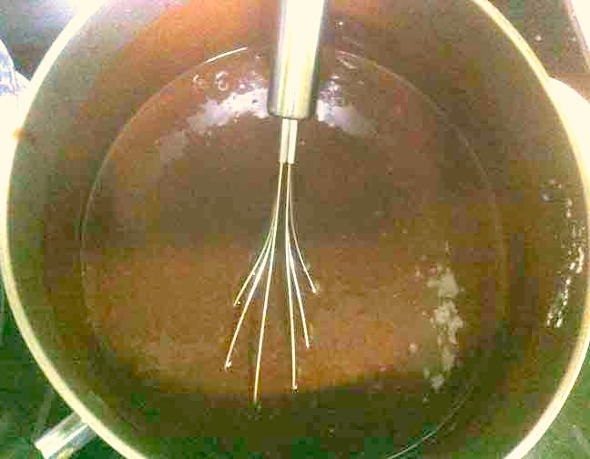 Death by chocolate recipe cupcake batter in a saucepan.