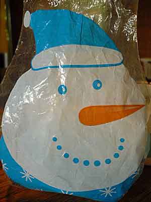 Plastic bag for gift basket decorated with a snowman