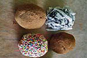 Homemade truffles covered in cinnamon, cocoa powder, coconut and sprinkles.