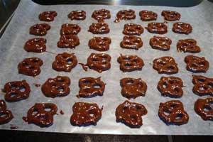 rows of chocolate covered pretzels on a pan