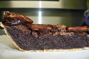 Slice of chocolate pecan pie.
