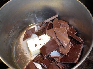Chocolate pieces, butter and water in a pan.