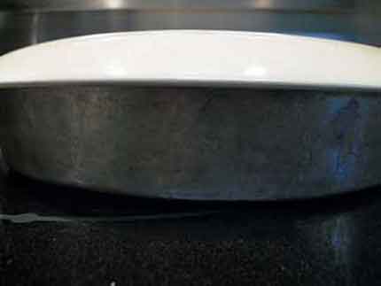 Cake pan with cake plate on top.